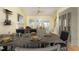 Inviting dining area with a fireplace, wet bar, and natural light, perfect for entertaining guests at 201 Lakewater Dr, Cary, NC 27511