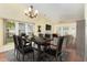 Bright dining room with large table, chandelier, and open-concept design at 201 Lakewater Dr, Cary, NC 27511