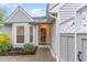 Inviting front entrance with well-manicured landscaping and stone accents at 201 Lakewater Dr, Cary, NC 27511