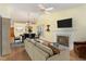 Spacious living area featuring fireplace, TV, and view into the dining room at 201 Lakewater Dr, Cary, NC 27511