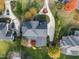 Aerial view of a home showcasing its well-maintained landscaping, circular driveway, and roof at 204 Oxford Mill Ct, Cary, NC 27518