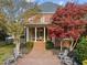 Charming brick patio with outdoor seating, perfect for enjoying the landscaped backyard at 204 Oxford Mill Ct, Cary, NC 27518