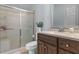 Bathroom featuring a vanity with granite counters, a sliding glass door shower and toilet at 204 Oxford Mill Ct, Cary, NC 27518
