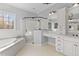 This primary bathroom has a glass shower, and a vanity with lots of storage at 204 Oxford Mill Ct, Cary, NC 27518