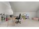 Bonus room with carpet, multiple shelves for storage, and angled ceilings at 204 Oxford Mill Ct, Cary, NC 27518