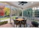 Relaxing covered patio with a ceiling fan, outdoor furniture, and a view of the backyard at 204 Oxford Mill Ct, Cary, NC 27518