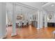 Elegant dining room features hardwood floors, stately columns, and decorative chandelier at 204 Oxford Mill Ct, Cary, NC 27518