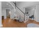 Spacious foyer showcasing hardwood floors, staircase, and views into the living room at 204 Oxford Mill Ct, Cary, NC 27518