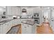 Kitchen featuring granite countertops, stainless steel appliances and white cabinetry at 204 Oxford Mill Ct, Cary, NC 27518
