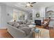 Beautiful living room featuring a cozy fireplace, large windows and natural light at 204 Oxford Mill Ct, Cary, NC 27518
