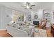 Cozy living room features a fireplace, built-in bookshelves, and large windows at 204 Oxford Mill Ct, Cary, NC 27518