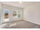 A bright bedroom with plush carpeting, natural light, and a private outdoor access at 219 Pond Vw Ct # 8, Fuquay Varina, NC 27526