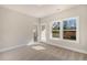 Well-lit bedroom showcasing neutral colors and a connecting door to the bathroom at 219 Pond Vw Ct # 8, Fuquay Varina, NC 27526