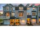 A row of inviting townhomes featuring a combination of stone and siding accents at 219 Pond Vw Ct # 8, Fuquay Varina, NC 27526