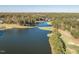 Beautiful aerial view of a golf course community with water features and lush green landscaping and bridges at 222 Kelso Ct, Cary, NC 27511