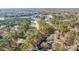 Panoramic aerial view of a golf course community, featuring a lake, fairways, and tree-lined streets with luxurious homes at 222 Kelso Ct, Cary, NC 27511