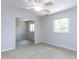 An unfurnished room with light carpet, a ceiling fan, and two windows at 222 Kelso Ct, Cary, NC 27511