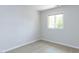 This bedroom has a neutral carpet, white walls, and a large window at 222 Kelso Ct, Cary, NC 27511