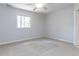 A sparsely furnished room with carpeted floors, a window, and neutral paint at 222 Kelso Ct, Cary, NC 27511