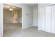 Neutral bedroom featuring a ceiling fan, closet, and view into the on-suite bathroom at 222 Kelso Ct, Cary, NC 27511