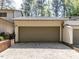 Two-car garage of home with a driveway and a well-maintained exterior at 222 Kelso Ct, Cary, NC 27511