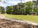 Scenic view of a meticulously maintained golf course with lush green fairways and mature trees lining the course at 222 Kelso Ct, Cary, NC 27511