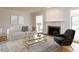 Comfortable living room featuring a fireplace, hardwood floors, and ample natural light at 222 Kelso Ct, Cary, NC 27511