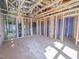 Bedroom during construction phase, showcasing exposed wooden framing, ductwork, and overall layout at 223 Pond Vw Ct # 10, Fuquay Varina, NC 27526