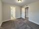 Well-lit bedroom with carpet flooring and access to an en-suite bathroom and closet at 223 Pond Vw Ct # 10, Fuquay Varina, NC 27526