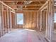 Room framed during construction, showcasing a window and open layout for design customization at 223 Pond Vw Ct # 10, Fuquay Varina, NC 27526