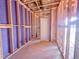 New entryway framing showing new drywall, wiring, and studs leading to the front door at 223 Pond Vw Ct # 10, Fuquay Varina, NC 27526