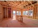 Unfinished living room framing with exposed studs, beams, and window framing, ready for finishing at 223 Pond Vw Ct # 10, Fuquay Varina, NC 27526