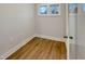 Bright room with wood flooring and a window allowing natural light at 223 Pond Vw Ct # 10, Fuquay Varina, NC 27526