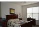Comfortable bedroom with a large window, ample natural light, and classic furnishings at 224 Eyam Hall Ln, Apex, NC 27502