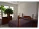 Traditional bedroom with a wooden four-poster bed, side tables, and a bright window at 224 Eyam Hall Ln, Apex, NC 27502