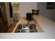 Functional kitchen sink area with stainless steel fixtures and a view of the laundry room at 224 Eyam Hall Ln, Apex, NC 27502