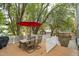 Spacious wooden deck provides an outdoor dining area with a table and chairs at 2256 W Front St, Burlington, NC 27215