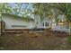 Backyard showcasing a deck and mature trees, providing a serene outdoor retreat at 2256 W Front St, Burlington, NC 27215