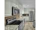 Bright kitchen with stainless appliances, granite countertops, tiled backsplash and flooring at 2256 W Front St, Burlington, NC 27215