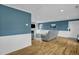 Comfortable living room with hardwood floors, wainscoting, and fireplace at 2256 W Front St, Burlington, NC 27215