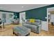 Comfortable living room featuring stylish furniture, hardwood floors, and natural light at 2256 W Front St, Burlington, NC 27215