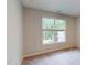 Cozy bedroom with neutral tones, plush carpet, and a large window providing natural light at 2313 Bay Minette Sta # 543, Apex, NC 27502