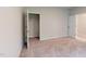 Spacious bedroom boasts neutral walls, plush carpeting, and convenient access to a closet and doorway at 2313 Bay Minette Sta # 543, Apex, NC 27502