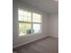 Bedroom featuring large window and neutral carpeting at 2313 Bay Minette Sta # 543, Apex, NC 27502