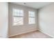Neutral bedroom featuring two windows offering community views at 2313 Bay Minette Sta # 543, Apex, NC 27502