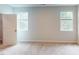 The bedroom is bright with two windows, neutral walls, and plush carpet at 2313 Bay Minette Sta # 543, Apex, NC 27502