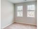 Neutral bedroom featuring plush carpet and large windows offering community views at 2313 Bay Minette Sta # 543, Apex, NC 27502