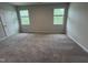 Spacious bedroom with plush carpeting and two windows at 2313 Bay Minette Sta # 543, Apex, NC 27502