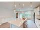Open kitchen with a large island, stainless steel appliances, and an adjacent living area at 2313 Bay Minette Sta # 543, Apex, NC 27502