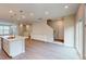 The kitchen is open to the living room and features a large center island and modern lighting at 2313 Bay Minette Sta # 543, Apex, NC 27502
